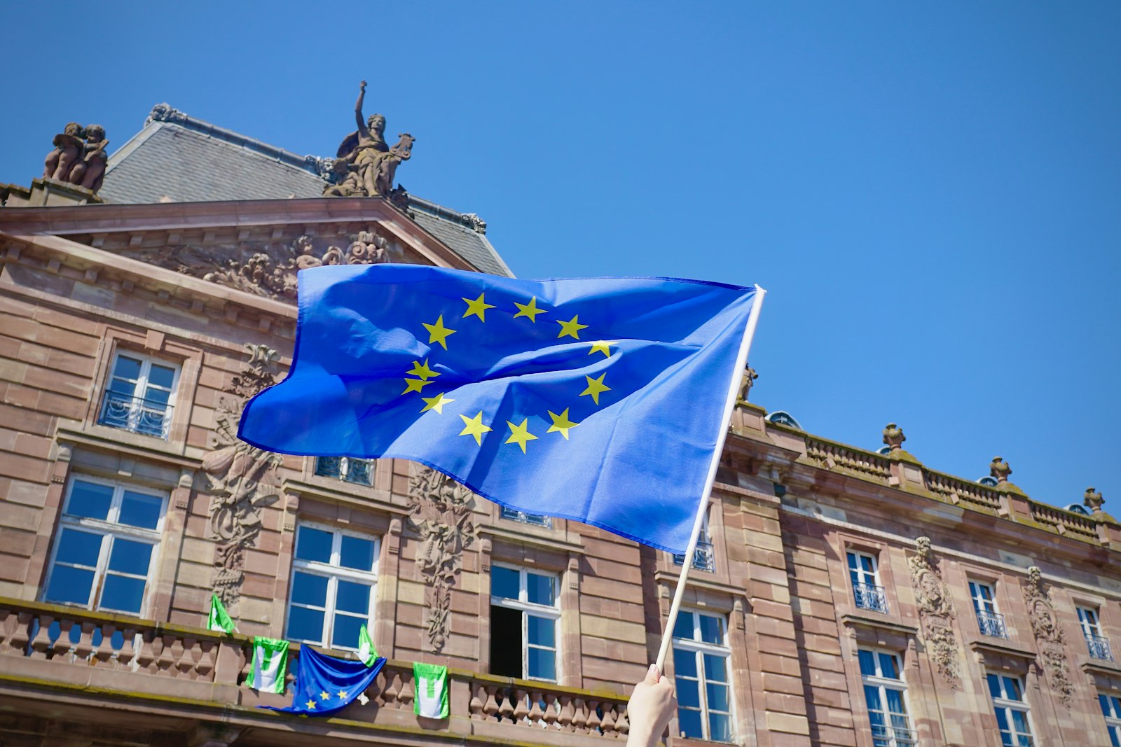 European Union flags outside an institutional building
