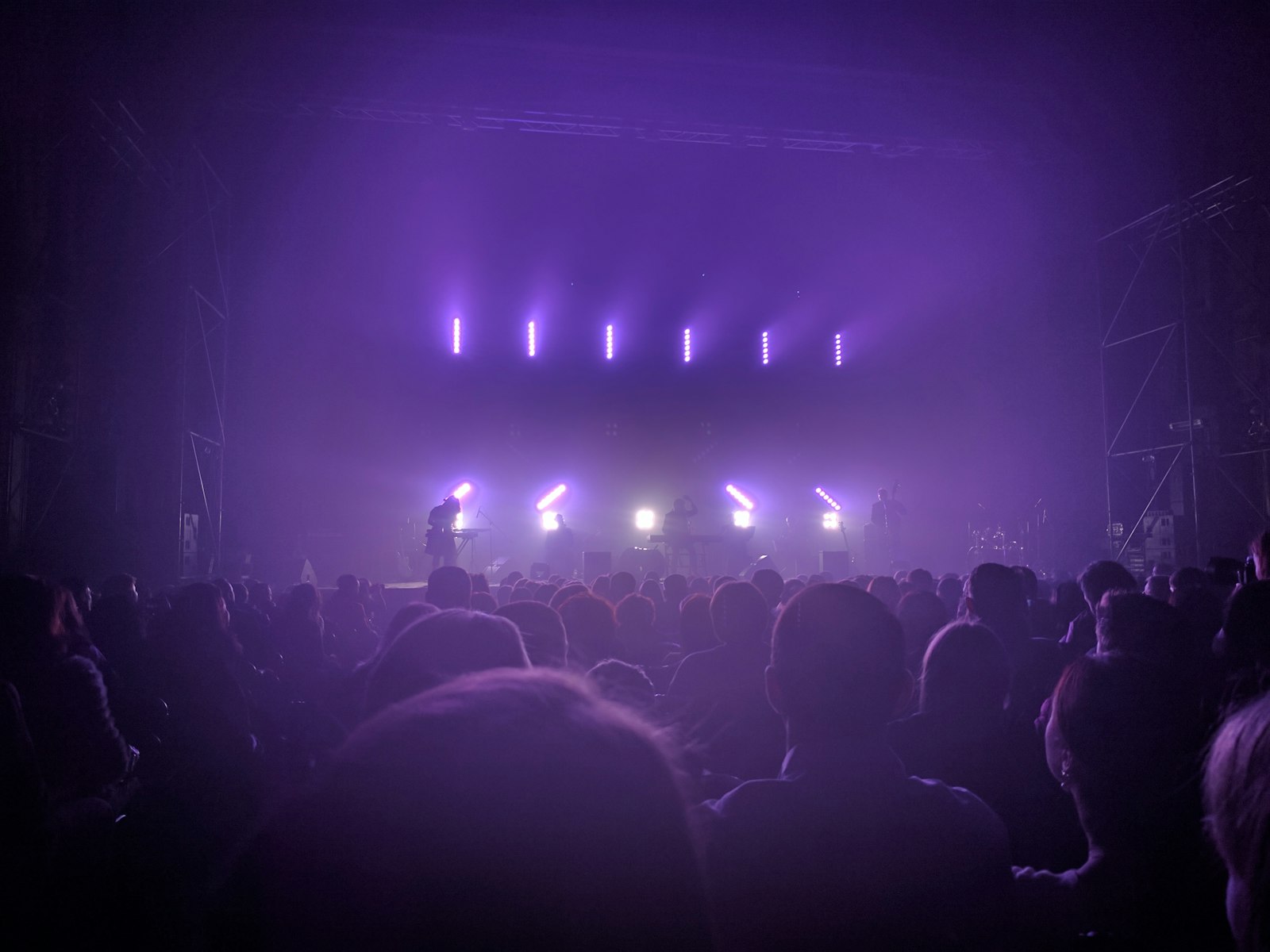 Tech conference stage lit with purple