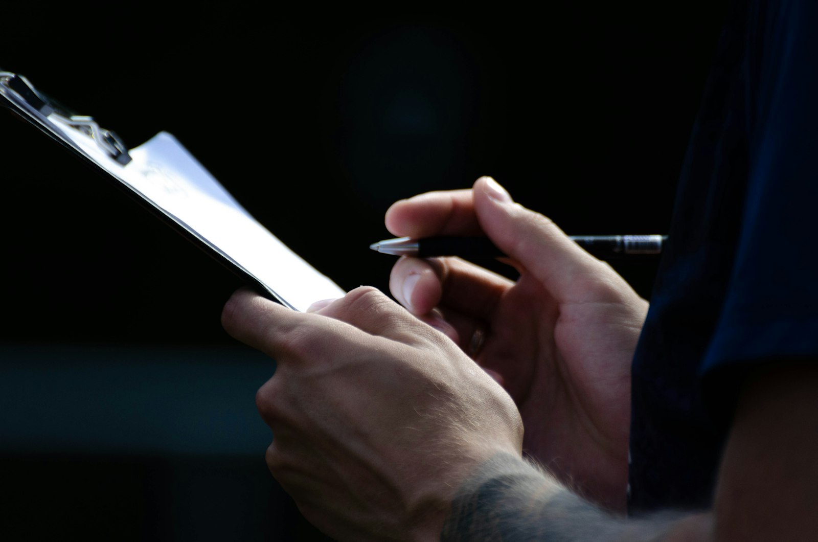 Hands holding a petition document